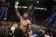 Floyd Mayweather Jr. celebrates his WBC-WBA welterweight title boxing fight victory over Marcos Maidana Saturday, May 3, 2014, in Las Vegas. (AP Photo/Eric Jamison)