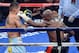 LAS VEGAS, NV - MAY 03: (R-L) Floyd Mayweather Jr. throws a left to the face of Marcos Maidana during their WBC/WBA welterweight unification fight at the MGM Grand Garden Arena on May 3, 2014 in Las Vegas, Nevada. (Photo by Ethan Miller/Getty Images)