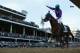 LOUISVILLE, KY - MAY 03: Jockey Victor Espinoza celebrates atop of California Chrome #5 after crossing the finish line to win the 140th running of the Kentucky Derby at Churchill Downs on May 3, 2014 in Louisville, Kentucky. (Photo by Matthew Stockman/Getty Images)