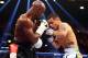 May 3, 2014; Las Vegas, NV, USA; Marcos Maidana defends against Floyd Mayweather Jr. during their fight at MGM Grand. Mandatory Credit: Mark J. Rebilas-USA TODAY Sports