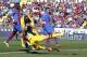 Atletico de Madrid's Diego Costa, front, shoots the ball as Levante's David Barral, right, and Simao, left, look on during a Spanish La Liga soccer match at the Ciutat de Valencia stadium in Valencia, Spain, on Sunday May 4, 2014. (AP Photo/Alberto Saiz)