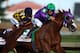 LOUISVILLE, KY - MAY 03: California Chrome #5, ridden by Victor Espinoza, comes out of the fourth turn enroute to winning the 140th running of the Kentucky Derby at Churchill Downs on May 3, 2014 in Louisville, Kentucky. (Photo by Andy Lyons/Getty Images)