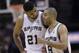 San Antonio Spurs' Tim Duncan (21) and Tony Parker (9) walk of the court during the second half of Game 7 of the opening-round NBA basketball playoff series against the Dallas Mavericks, Sunday, May 4, 2014, in San Antonio. San Antonio won 119-96. (AP Photo/Eric Gay)