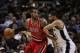 Mar 12, 2014; San Antonio, TX, USA; Portland Trail Blazers forward LaMarcus Aldridge (12) posts up against San Antonio Spurs forward Tim Duncan (21) during the first half at AT&T Center. Mandatory Credit: Soobum Im-USA TODAY Sports