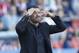 Atletico de Madrid's coach Diego Simeone from Argentina gestures during a Spanish La Liga soccer match against Levante at the Ciutat de Valencia stadium in Valencia, Spain, on Sunday, May 4, 2014. (AP Photo/Alberto Saiz)