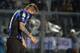 Atalanta's German Denis, of Argentina, covers his face after missing a scoring chance during a Serie A soccer match against Genoa in Bergamo, Italy, Sunday, April 27, 2014. (AP Photo/Felice Calabro')