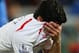 Liverpool's Luis Suarez, holds his shirt to his face following the end of the English Premier League soccer match between Crystal Palace and Liverpool at Selhurst Park stadium in London, Monday, May 5, 2014. The game ended in a 3-3 draw. (AP Photo/Alastair Grant)