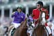 May 3, 2014; Louisville, KY, USA; Victor Espinoza gestures towards California Chrome after winning the 2014 Kentucky Derby at Churchill Downs. Mandatory Credit: Brian Spurlock-USA TODAY Sports