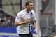 Manchester City's Edin Dzeko celebrates after scoring the second goal of the game during their English Premier League soccer match against Everton at Goodison Park in Liverpool, England, Saturday May 3, 2014. (AP Photo/Clint Hughes)
