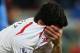 Liverpool's Luis Suarez, holds his shirt to his face following the end of the English Premier League soccer match between Crystal Palace and Liverpool at Selhurst Park stadium in London, Monday, May 5, 2014. The game ended in a 3-3 draw. (AP Photo/Alastair Grant)