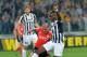 Paul Pogba, pictured with Benfica's Maxi Pereira, will want more from Juve's European adventures.