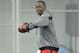 Louisville quarterback Teddy Bridgewater warms up before participating in passing drills for NFL representatives during pro day at the University of Louisville in Louisville, Ky., Monday, March 17, 2014. (AP Photo/Timothy D. Easley)