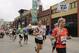 FILE - In this May 21, 2011 file photo provided by the Department of Defense, Maj. George Kraehe, of Albequerque, N.M., center, and other runners pass the Fargo Theater during a marathon in Fargo, N.D. The Fargo Marathon, being run Saturday, May, 10, 2014, is celebrating its 10th anniversary this year with more than 23,000 participants. (AP Photo/Department of Defense, Senior Master Sgt. David H. Lipp, File)