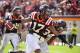 Oct 5, 2013; Blacksburg, VA, USA; Virginia Tech Hokies cornerback Kyle Fuller (17) celebrates with safety Kyshoen Jarrett (34) after making an interception in the fourth quarter. The Hokies defeated the Tar Heels 27-17 at Lane Stadium. Mandatory Credit: Bob Donnan-USA TODAY Sports