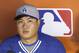 Los Angeles Dodgers pitcher Hyun-Jin Ryu of South Korea is shown during an interview before a baseball game against the Miami Marlins, Saturday, May 3, 2014 in Miami. (AP Photo/Wilfredo Lee)
