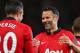 MANCHESTER, ENGLAND - MAY 06: Robin van Persie of Manchester United is congratulated by Caretaker Manager Ryan Giggs after scoring his team's third goal during the Barclays Premier League match between Manchester United and Hull City at Old Trafford on May 6, 2014 in Manchester, England. (Photo by Alex Livesey/Getty Images)