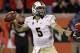 Central Florida quarterback Blake Bortles passes against Louisville in the second half of an NCAA college football game in Louisville, Ky., Friday, Oct. 18, 2013. Bortles completed 21 of 32 passes for 250 yards and two touchdowns, as Central Florida won 38-35. (AP Photo/Garry Jones)