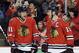 Chicago Blackhawks' Jonathan Toews (19) , right, smiles as he talks with Marian Hossa (81) after scoring hi goal during the first period in Game 2 of an NHL hockey second-round playoff series against the Minnesota Wild in Chicago, Sunday, May 4, 2014. (AP Photo/Nam Y. Huh)