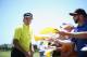 Bubba Watson signs autographs.