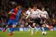 LONDON, ENGLAND - MAY 05: Lucas Leiva of Liverpool passes the ball as Joe Ledley of Crystal Palace closes in during the Barclays Premier League match between Crystal Palace and Liverpool at Selhurst Park on May 5, 2014 in London, England. (Photo by Clive Rose/Getty Images)