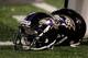 BALTIMORE, MD - AUGUST 25: A pair of Baltimore Ravens helmets sit on the sidelines during the Ravens game against the Washington Redskins at M