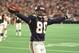 Minnesota Vikings' Cris Carter celebrates a touchdown catch from quarterback Daunte Culpepper against the Buffalo Bills on Oct. 22, 2000, in Minneapolis. Carter needs just seven catches to join San Francsico 49ers Jerry Rice as only the second wide receiver in NFL history to make 1,000 pass receptions. (AP Photo/Tom Olmscheid)