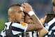 Juventus midfielder Claudio Marchisio, center, celebrates after scoring with teammate Arturo Vidal during the Europa League quarterfinal soccer match between Juventus and Olympic Lyon at the Juventus stadium, in Turin, Italy, Thursday, April 10, 2014. (AP Photo/ Massimo Pinca)