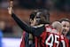 MILAN, ITALY - MARCH 29: Mario Balotelli of AC Milan celebrates scoring the first goal during the Serie A match between AC Milan and AC Chievo Verona at San Siro Stadium on March 29, 2014 in Milan, Italy. (Photo by Claudio Villa/Getty Images)