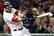 Boston Red Sox's Mike Napoli hits an RBI single in the fifth inning of the second baseball game of a doubleheader against the Tampa Bay Rays in Boston, Thursday, May 1, 2014. (AP Photo/Michael Dwyer)
