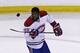 Montreal Canadiens defenseman P.K. Subban flips the puck prior to facing the Boston Bruins in Game 2 in the second-round of the Stanley Cup hockey playoff series in Boston, Saturday, May 3, 2014. (AP Photo/Charles Krupa)