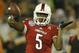 Louisville quarterback Teddy Bridgewater (5) throws a pass warming up for the Russell Athletic Bowl NCAA college football game against Miami in Orlando, Fla., Saturday, Dec. 28, 2013.(AP Photo/John Raoux)