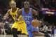 Oklahoma City Thunder's Reggie Jackson (15) drives past Cleveland Cavaliers' Jarrett Jack (1) during an NBA basketball game Thursday, March 20, 2014, in Cleveland. (AP Photo/Tony Dejak)