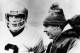 Notre Dame quarterback Joe Montana has a last minute talk with head coach Dan Devine in closing minutes of game with the University of Houston at Cotton Bowl classic on Jan. 2, 1979 in Dallas, Texas. Notre Dame won the hard-fought game 35- 34. (AP Photo/Bill Haber)