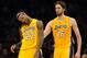 November 9, 2012; Los Angeles, CA, USA; Los Angeles Lakers power forward Pau Gasol (16) looks on as center Jordan Hill (27) stretches his neck after he was fouled in the first half of the game at the Staples Center. Mandatory Credit: Jayne Kamin-Oncea-USA TODAY Sports