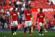 MANCHESTER, ENGLAND - MAY 03: Dejected Manchester United players walk off the pitch following their team's1-0 defeat during the Barclays Premier League match between Manchester United and Sunderland at Old Trafford on May 3, 2014 in Manchester, England. (Photo by Shaun Botterill/Getty Images)