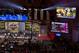 Large television monitors display information above participants of the NFL Draft, Saturday, April 27, 2013 at Radio City Music Hall in New York. (AP Photo/Craig Ruttle)