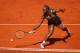 Serena Williams slides to the ball in a third-round match at 2014 Madrid Open.