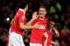 MANCHESTER, ENGLAND - FEBRUARY 01: Nemanja Vidic of Manchester United celebrates scoring his team's third goal with team mates Rio Ferdinand and Patrice Evra (R) during the Barclays Premier League match between Manchester United and Aston Villa at Old Trafford on February 1, 2011 in Manchester, England. (Photo by Clive Mason/Getty Images)