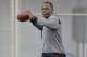 Louisville quarterback Teddy Bridgewater warms up before participating in passing drills for NFL representatives during pro day at the University of Louisville in Louisville, Ky., Monday, March 17, 2014. (AP Photo/Timothy D. Easley)