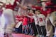 Nebraska fans try to touch players running onto the field prior to the first half of an NCAA college football game against Michigan State in Lincoln, Neb., Saturday, Nov. 16, 2013. (AP Photo/Nati Harnik)