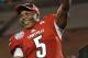 Louisville quarterback Teddy Bridgewater (5) holds up the MVP trophy after Louisville defeated Miami 36-9 in the Russell Athletic Bowl NCAA college football game in Orlando, Fla., Saturday, Dec. 28, 2013.(AP Photo/John Raoux)