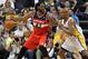 May 7, 2014; Indianapolis, IN, USA; Washington Wizards forward Nene (42) is guarded by Indiana Pacers forward David West (21) in game two of the second round of the 2014 NBA Playoffs at Bankers Life Fieldhouse. Indiana defeats Washington 86-82. Mandatory Credit: Brian Spurlock-USA TODAY Sports