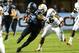 Oct 17, 2013; Chapel Hill, NC, USA; North Carolina Tar Heels tight end Eric Ebron (85) runs for a touchdown as Miami Hurricanes linebacker Raphael Kirby (56) defends in the first quarter at Kenan Memorial Stadium. Mandatory Credit: Bob Donnan-USA TODAY Sports