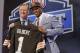 Oklahoma State cornerback Justin Gilbert, right, poses with NFL commissioner Roger Goodell after being selected by the Cleveland Browns as the eighth pick in the first round of the 2014 NFL Draft, Thursday, May 8, 2014, in New York. (AP Photo/Craig Ruttle)