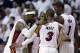 Miami Heat's LeBron James, left, Dwyane Wade (3), Chris Bosh (1) and Ray Allen, center, huddle on the court in the second half of Game 1 in an NBA basketball Eastern Conference semifinal playoff series against the Brooklyn Nets, Tuesday, May 6, 2014, in Miami. The Heat defeated the Nets 107-86. (AP Photo/Lynne Sladky)