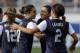 United States' Carli Lloyd (10) is congratulated by teammates Christen Press, center, and Sydney Leroux (2) after Lloyd scored against Russia during a friendly international soccer match in Boca Raton, Fla., Saturday, Feb. 8, 2014. The U.S. won 7-0. (AP Photo/Alan Diaz)