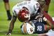 AUBURN, AL - AUGUST 31: Safety Deone Bucannon #20 of the Washington State Cougars lies on running back Corey Grant #20 of the Auburn Tigers after tackling him during the second half of play on August 31, 2013 at Jordan-Hare Stadium in Auburn, Alabama. Auburn defeated Washington State 31-24. (Photo by Michael Chang/Getty Images)