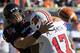 Cincinnati quarterback Zach Collaros fumbles the ball as he is sacked by Louisville defensive end Marcus Smith (17) during the first half of an NCAA college football game, Saturday, Oct. 15, 2011, in Cincinnati. Cincinnati recovered the fumble. (AP Photo/Al Behrman)