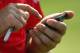 CHASKA, MN - AUGUST 11: Ian Poulter of England uses his phone during the second preview day of the 91st PGA Championship at Hazeltine National Golf Club on August 11, 2009 in Chaska, Minnesota. (Photo by Scott Halleran/Getty Images)