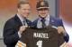 Texas A&M quarterback Johnny Manziel poses with NFL commissioner Roger Goodell after being selected by the Cleveland Browns as the 22nd pick in the first round of the 2014 NFL Draft, Thursday, May 8, 2014, in New York. (AP Photo/Frank Franklin II)